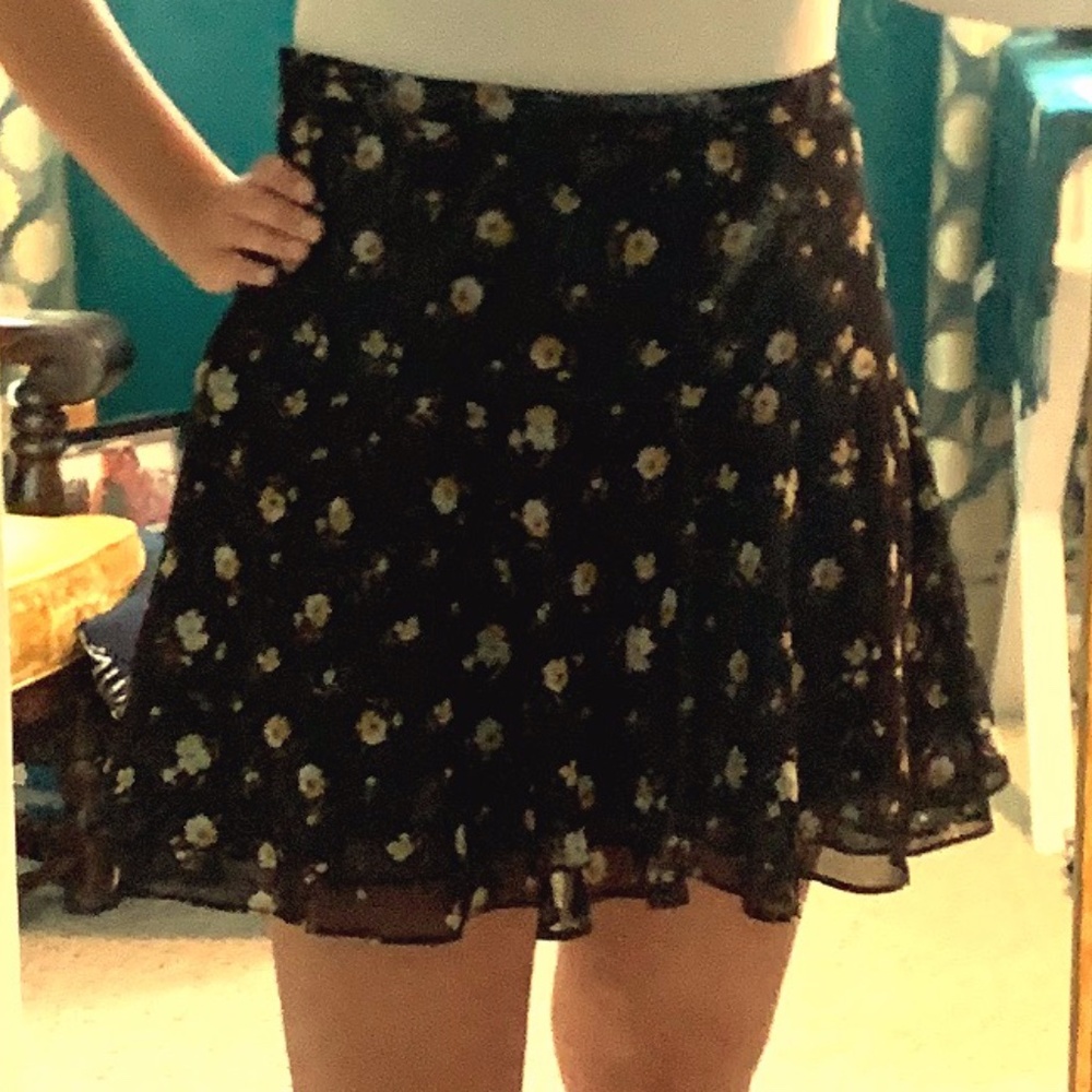 Black floral patterned mini skirt